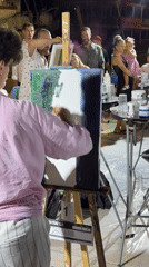 Live painting competition draws a crowd in Tivat at night.
