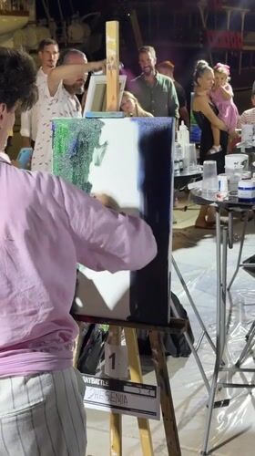 Live painting competition draws a crowd in Tivat at night.
