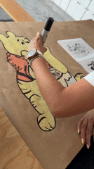 Woman creates large Winnie the Pooh drawing in Puebla studio