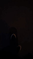 Person in white shoes filmed in darkness in Yekaterinburg