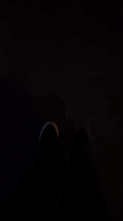 Person in white shoes filmed in darkness in Yekaterinburg