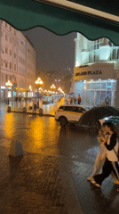 Rainy night street scene captured by witnesses in urban area