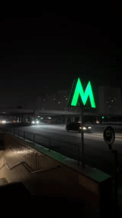 Snowy winter evening traffic captured across central Kyiv