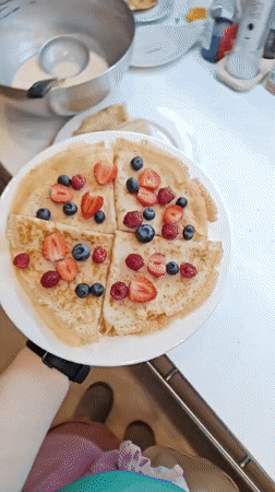 Fresh berry crepes plated and shot from every angle