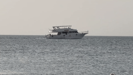 Morning coastal scenes feature yacht, abandoned bicycle, beaches