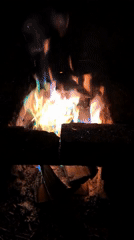 Campfire burns in brick enclosure in Shabury, Russia
