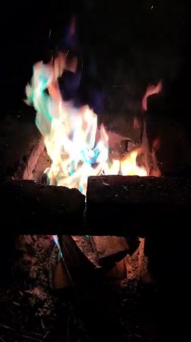 Campfire burns in brick enclosure in Shabury, Russia