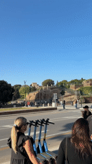 Morning scenes captured at Rome's Colosseum with clear skies