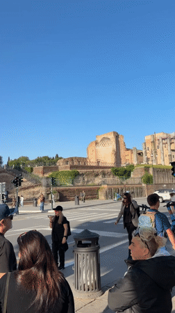 Morning scenes captured at Rome's Colosseum with clear skies