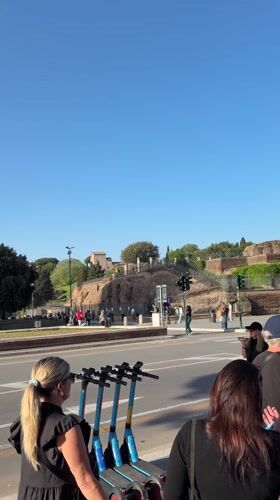 Morning scenes captured at Rome's Colosseum with clear skies