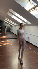 Woman in athletic wear walks through Riga sports facility