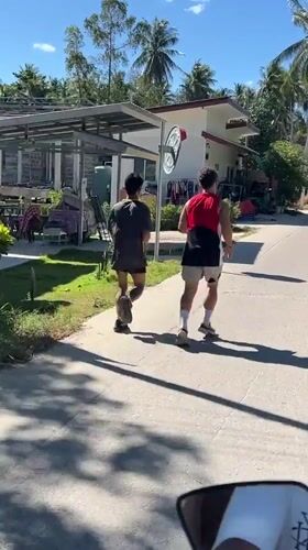 Morning jog along a sun-drenched road on Koh Phangan
