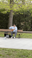 Street musician plays ukulele in Warsaw park