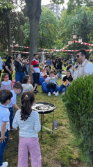 Street performer creates giant bubbles for children in Tbilisi park
