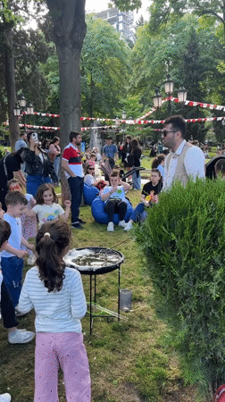 Street performer creates giant bubbles for children in Tbilisi park