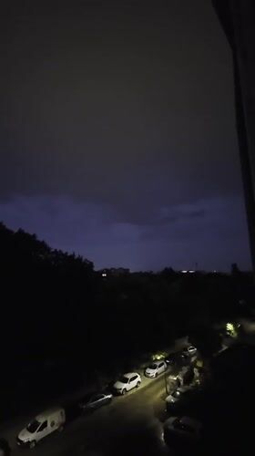 Summer night in Plovdiv, faint lightning glow over the city