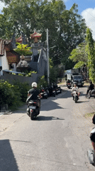 Traditional gathering and street life captured in North Kuta