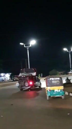 Barakin Angundi roadside at night: traffic, trade, and movement