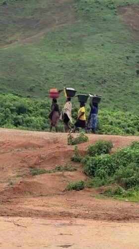 Daily life documented in rural Jawu, Nigeria near rocky landscape