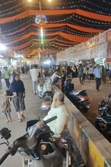 Mumbai street scene shows festival decorations with orange fabric