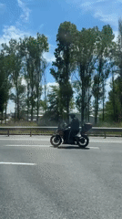Motorcyclist travels highway in Gaziosmanpaşa, Turkey