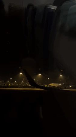 Passenger documents nighttime aircraft operations at Shanghai Pudong Airport