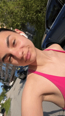 Woman in athletic wear films herself on Gabrovo street