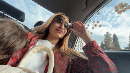 Woman in car and mountain landscape captured in Montenegro