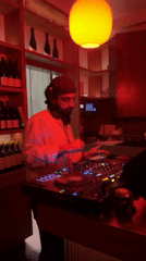 DJ performs at LA venue as nightlife continues nearby