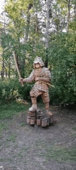 Svirsk park with wooden samurai sculpture and modern pavilions