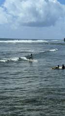 Surfers ride waves in General Luna, Philippines waters