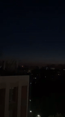 Twilight cityscape captured from elevated view in Kyiv