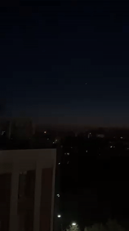 Twilight cityscape captured from elevated view in Kyiv