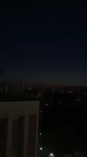 Twilight cityscape captured from elevated view in Kyiv