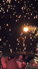 Fire dancer performs with fireworks show in Baan Bo Phut