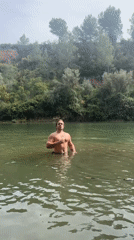 Man drinks Corona beer in river at Spanish waterfall