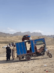 Riverside market gathering documented in Afghanistan's mountainous region