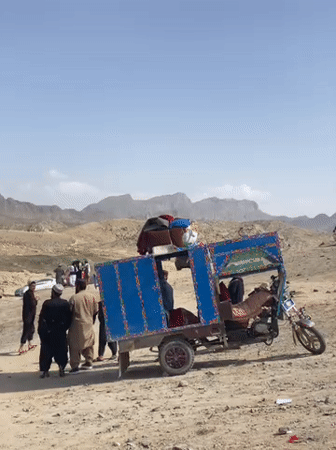Riverside market gathering documented in Afghanistan's mountainous region