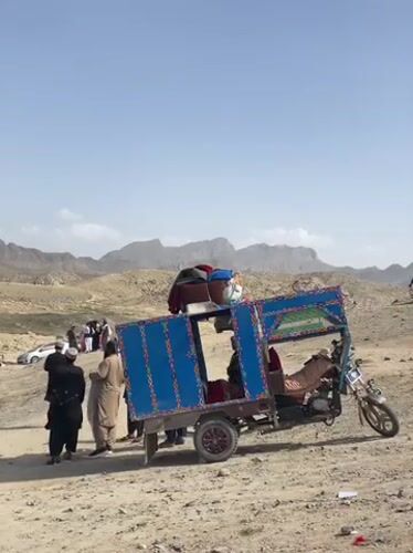 Riverside market gathering documented in Afghanistan's mountainous region