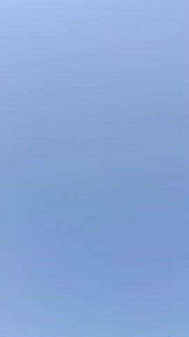 This is a static video recording of a clear blue sky. There are no discernible objects, people, or actions within the frame. The lighting appears to be natural daylight, consistent with an outdoor environment on a clear day. The camera remains stationary throughout the duration of the recording.