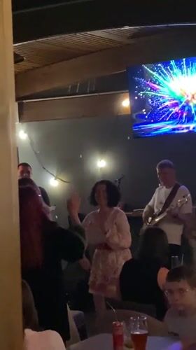 Live band entertains dancing crowd at Bar, Montenegro venue