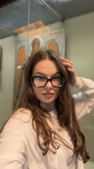 Woman documents Moscow museum visit, capturing religious artifacts and portraits