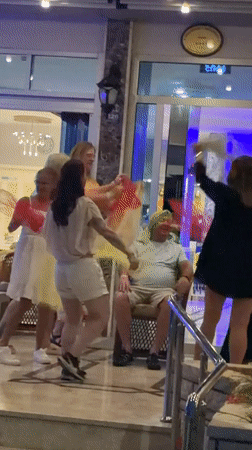 Belly dancers perform for tourists outside Alanya hotel