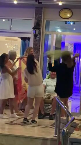 Belly dancers perform for tourists outside Alanya hotel