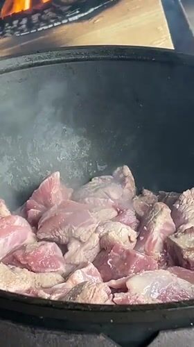 Traditional outdoor cooking scene documented in Valevaya, Russia
