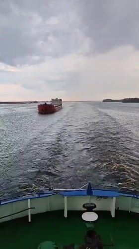 Cargo ships navigate choppy waters near Novokemskii, Russia