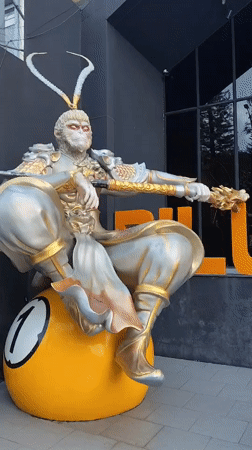 Da Lat street scenes feature Monkey King statue, hotels