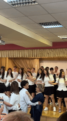 Students perform choir presentation at Yerevan school auditorium