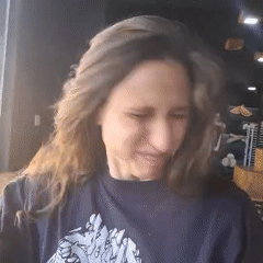 Woman photographed multiple times outside Sarandí shop window