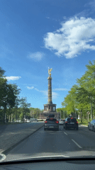 Vehicle passenger photographs Berlin's Victory Column monument